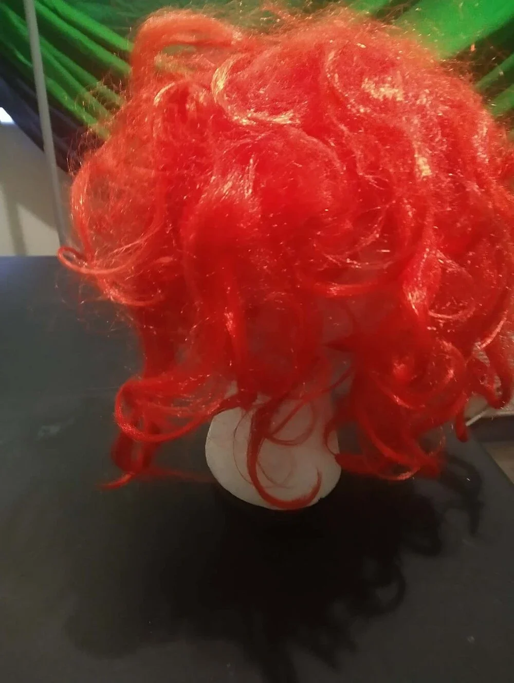 Warner Bros. / Rubie’s scary clown latex mask with bright red synthetic hair